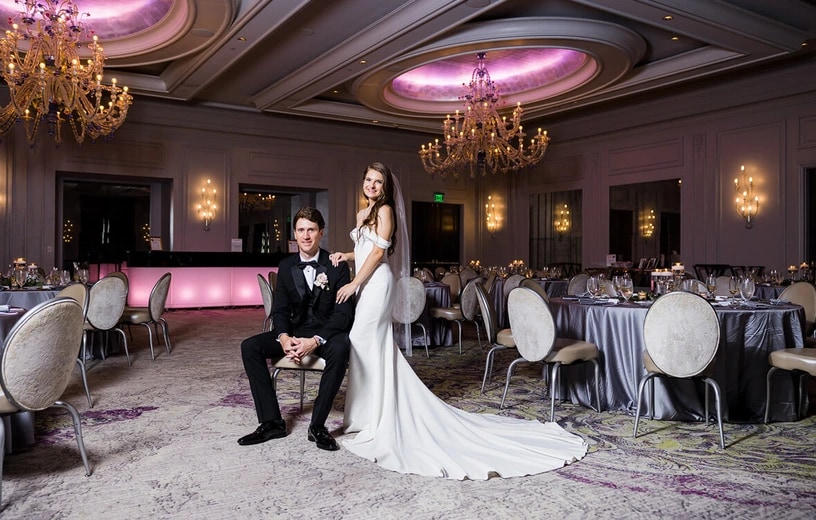 Elegant wedding reception table setting with florals and candles